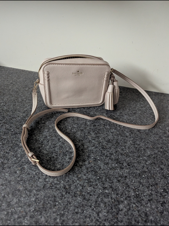 kate spade Handbags - kate spade Pebbled Leather Crossbody in Light Beige with Tassel Charm